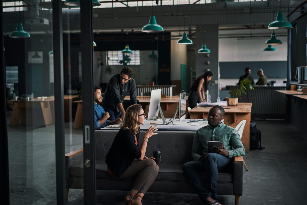 Shot of a group of businesspeople working together in a modern office