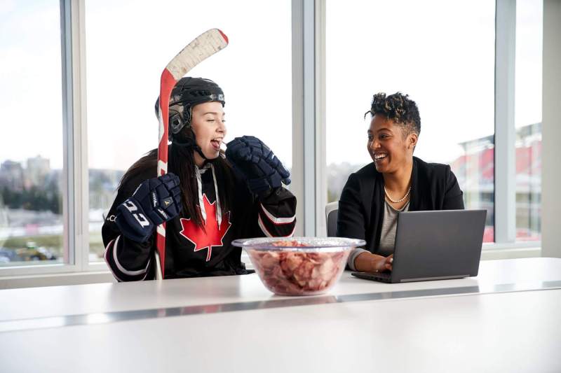 Hockey player eats ketchup chips at meeting