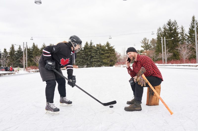 Lumberjack takes a call before the big game