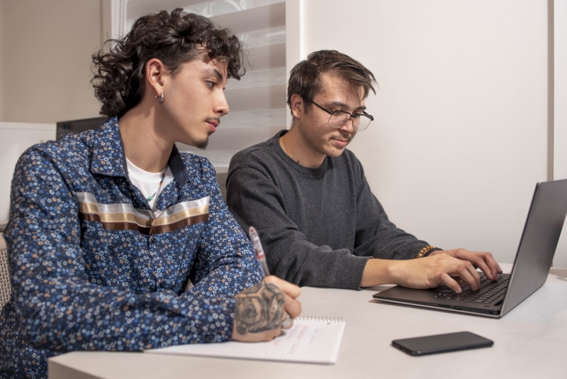 Colleagues taking notes and working on a project