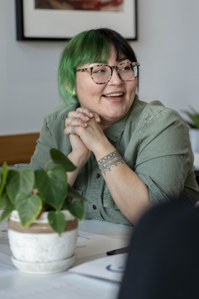 Happy woman in cafe catching up with friends