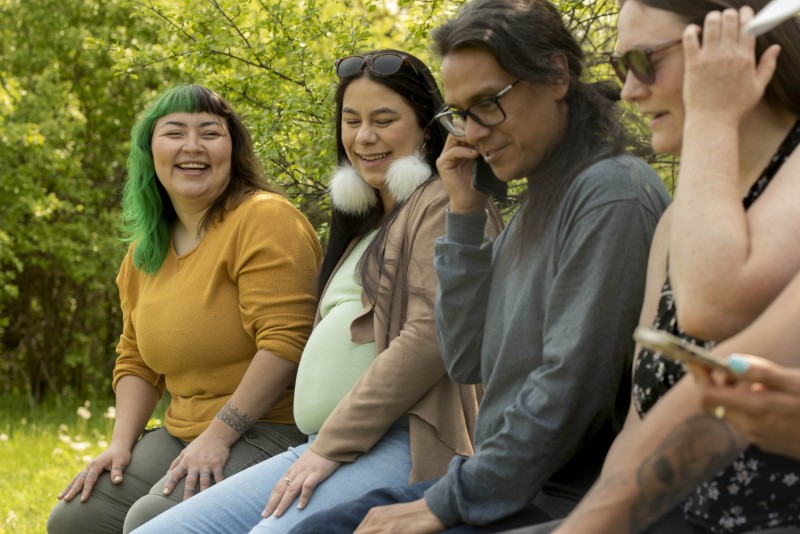 Happy women catching up with friends in nature