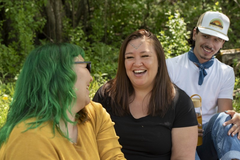Happy women having fun with friends at a picnic
