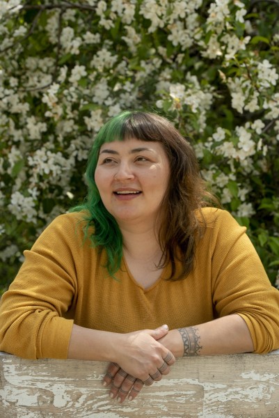 Portrait of a woman surrounded by white flowers