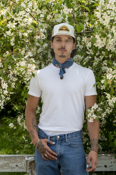 Portrait of man surrounded by flowers