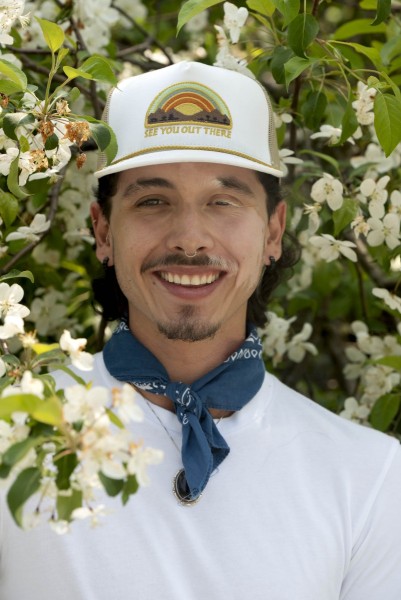 Portrait of man surrounded by flowers