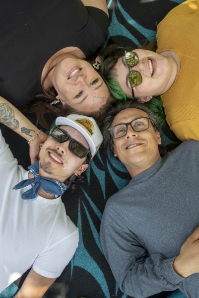 Friends laying on a picnic blanket
